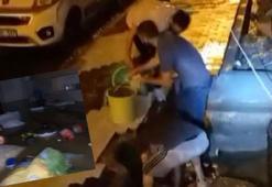 Arnavutköy'de bodrum katı su bastı; rögardaki suları kovalarla boşalttılar