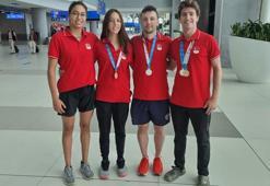 Yunanistan'da 4 madalya kazanan Paletli Yüzme Milli Takımı, yurda döndü