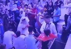 Damat, para takılı gelinliği çekiştiren çocuğu fırlatıp yere attı