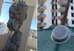 Depremde ağır hasar alan binada hatılın içinden metal kap çıktı