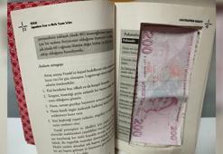 Sahte paralar, kitabın içindeki zuladan çıktı