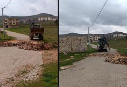 Arsasından geçen yolu kepçeyle kazdırıp, taşlarla kapattı