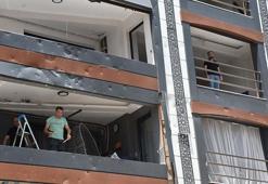 İzmir'de patlamanın olduğu sokakta yaşayanlar temizlik ve onarım yapıyor