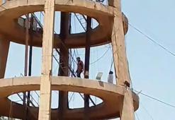 Şanlıurfa'da işten çıkartılan işçiler su kulesinde eylem yaptı