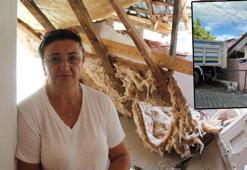 Yokuş çıkarken geri kayan kamyon evine çarptı, kendini dışarı atarak kurtuldu