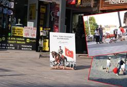 Atatürklü, Türk bayraklı devrilmiş portreyi gören kaldırdı; o anlar kamerada