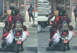 6 kişinin bindiği motosiklette çocuklar çuvalla taşındı