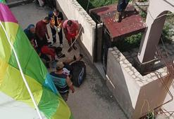 İnişte çatıya çarpıp düşen yamaç paraşütçüsü yaralandı