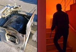 Alev alan çamaşır kurutma makinesini apartman boşluğuna attı