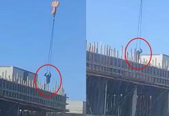 Büyükçekmece'de vincin halatına oturup yandaki inşaata geçti; o anlar kamerada