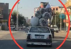 Otomobilinin tavanına bağladığı 6 çuval pamukla trafikte seyretti; o anlar kamerada