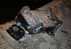 Geri kayan otomobil, dere yatağına uçtu: 2 yaralı