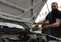 Arızalanan aracını, gaz koluna ip bağlayıp, 1,5 kilometre uzaklıktaki sanayiye götürdü