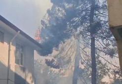 Araştırma merkezinin bahçesinde çıkan yangın, yan binanın çatısına sıçradı