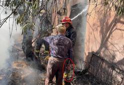 Ev sahibi, elindeki keserle itfaiyecilere yardıma koştu