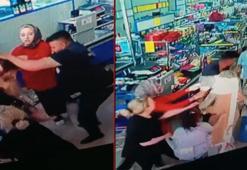 Marketteki kasa sırası tartışmasında 3 kişiyi darbetti; o anlar kamerada