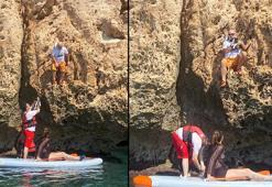 SUP board yaparken falezlerde mahsur kalan anne kediyi kurtardılar