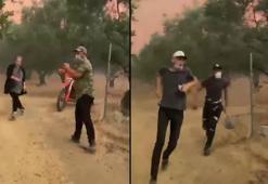 Belediye ekipleri, yangının tehdit ettiği evdeki aileyi tahliye ederken alevlerin ortasında kaldı