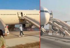 Antalya Havalimanında iniş takımından duman çıkan uçağın yolcuları slayt açılarak tahliye edildi