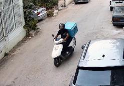 Motokurye, yağmur suyu tahliye borusundan tırmandığı daireden cep telefonu ve cüzdan çaldı