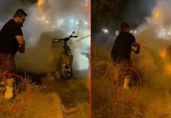 Motosikletteki yangına kırık bacağıyla müdahale etti; o anlar kamerada