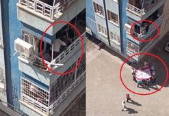 Balkondan düşme tehlikesi geçiren Down sendromlu çocuğu, komşusu kurtardı; o anlar kamerada