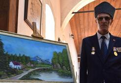 Kıbrıs gazisi, Bob Ross'dan esinlenip ressam oldu; ilk sergisini açtı