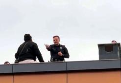 Çatıya çıkan kapıcıyı, başkomiser ikna etti