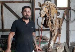 Öldürülen aslan 'Zeus'un ağaçtan heykelini yaptı