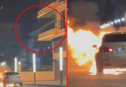 Alev alan otomobile, balkondan hortumla su sıktı; o anlar kamerada