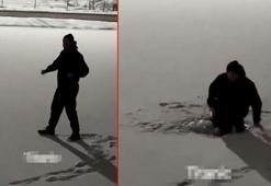 Buz tutan göletin üzerinde dans ederken suya düştü