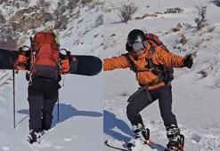 Diş hekimi tırmandığı dağdan snowboard yaparak indi