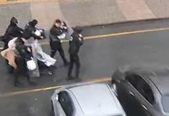 İstanbul'da polis kalkanı anne ve bebeğini fırtınadan korudu