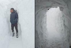 Kar kalınlığının 2 metreyi bulduğu mezrada evi ile ahırı arasına tünel açtı