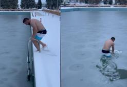 Yüzeyi buz tutan havuzda yüzdü; o anlar kamerada