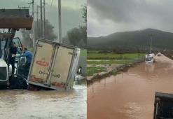 Bodrum'da sağanak; su dolan yolda kalan kamyonetin sürücüsü kepçeyle kurtarıldı
