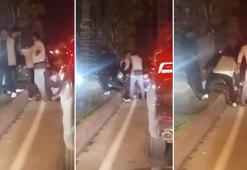 Tartıştıkları kişiyi yere yatırıp darbettiler