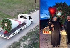 Oto kurtarıcı üzerine yerleştirdiği dev buketle evlilik teklifi etti