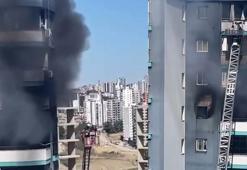 Apartmanda çıkan yangında mahsur kalan baba ve bebeğini inşaat işçisi kurtardı