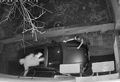 Hırsızlık için tırmandığı binada fark edilince, otomobilin üzerine atlayıp kaçtı