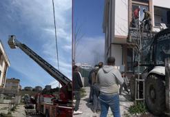 Arnavutköy’de binada çıkan yangında mahsur kalanlar kepçeyle kurtarıldı