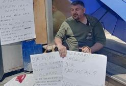 Evden çıkarılan kalp hastası kiracıdan 'Benim kalbim hasta, senin vicdanın' yazılı pankartla eylem