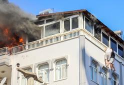 Yangında teras korkuluğundan sarkıp, kurtarılmayı beklediler