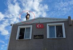Kaçak evinin yıkımına engel olmak için benzin bidonuyla çatıya çıktı