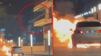 Alev alan otomobile, balkondan hortumla su sıktı; o anlar kamerada