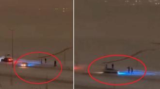 Otomobili ile karlı yolda drift yapan sürücü kamerada