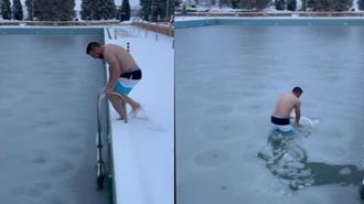 Yüzeyi buz tutan havuzda yüzdü; o anlar kamerada