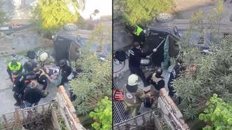 Merdivenlerden düşüp yan yatan araçta sıkışan yolcuyu itfaiye kurtardı; o anlar kamerada