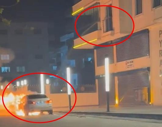 Alev alan otomobile, balkondan hortumla su sıktı; o anlar kamerada