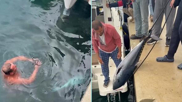 Soğuk havaya aldırış etmeden denize girip kıyıya vuran orkinosu çıkardı